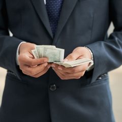 Businessman with dollar currencies