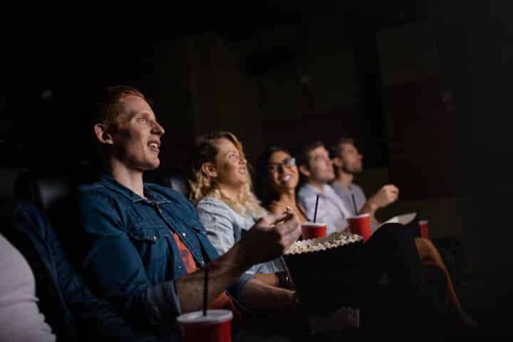 audience captured by security cameras in movie theaters