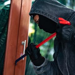 Burglar trying to force a door