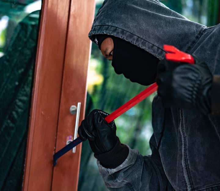 Burglar trying to force a door