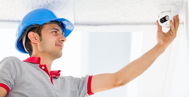 CCTV Technician adjusting a camera