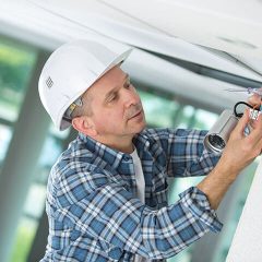 contractor installing a security camera system