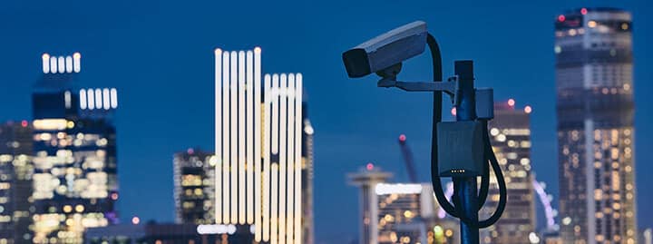 security camera against urban skyline