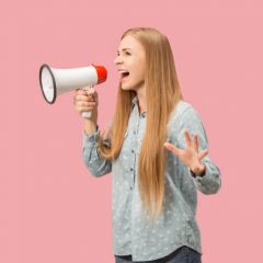 woman making announcement with megaphone