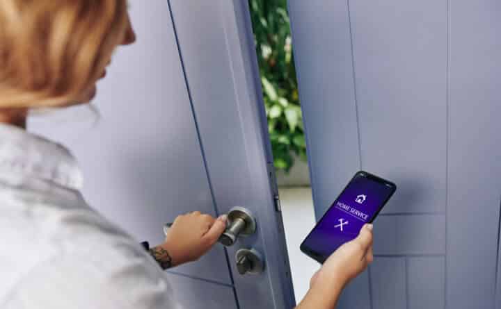 woman using home service application to open the door